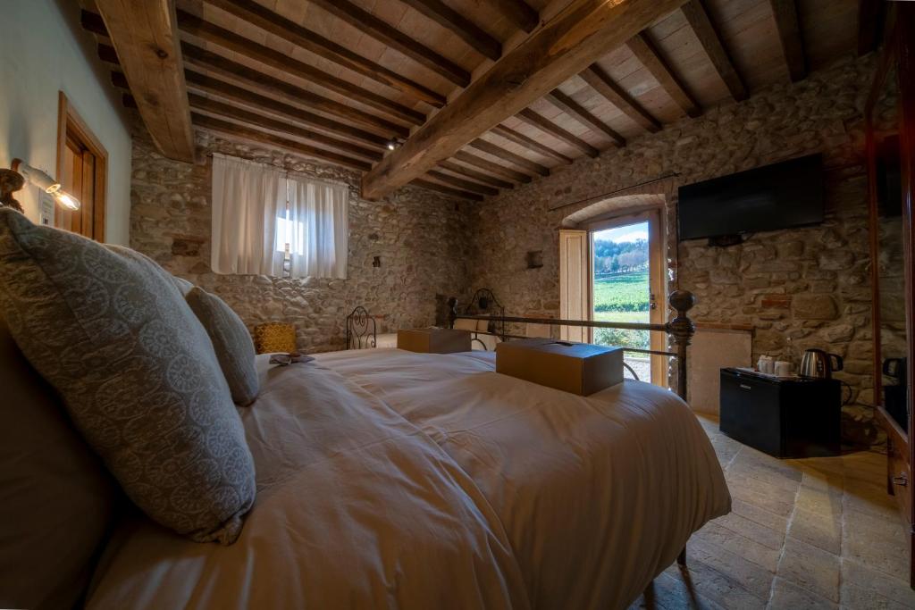 Łóżko lub łóżka w pokoju w obiekcie Agriturismo Podere Tovari