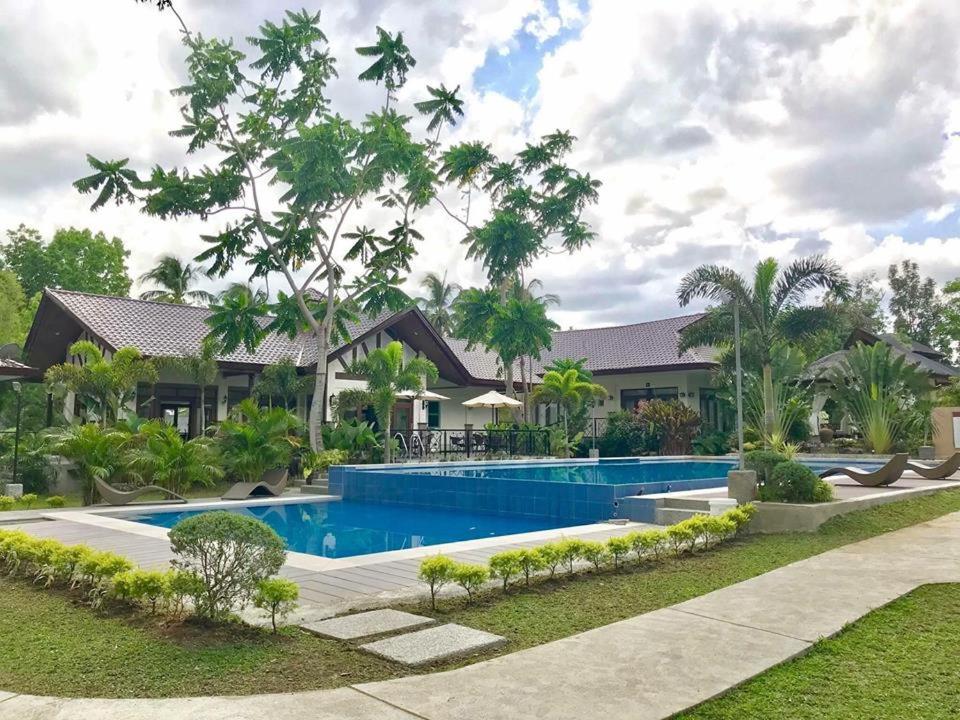 an image of a house with a swimming pool at The Zen Villas Resort in Lipa
