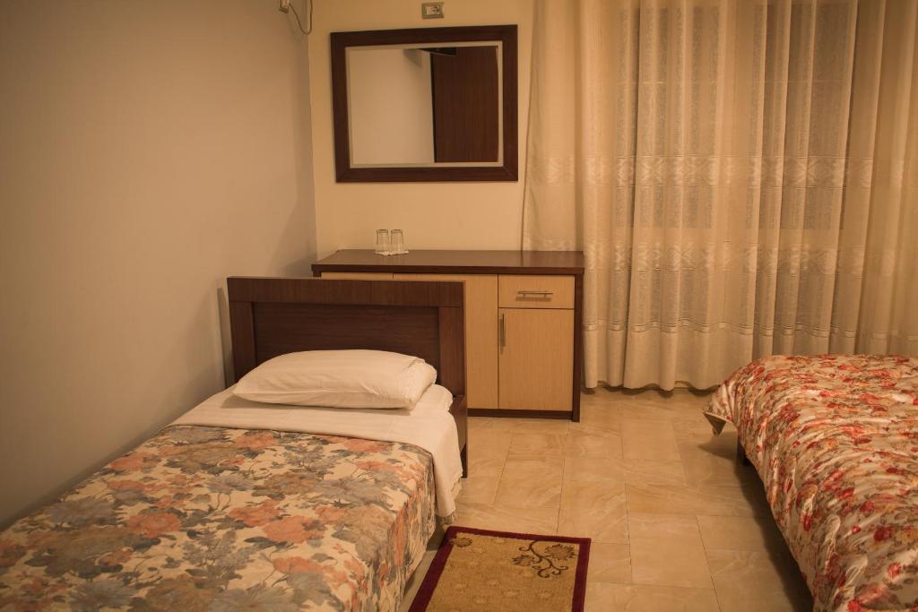 Postel nebo postele na pokoji v ubytování Grand Hotel