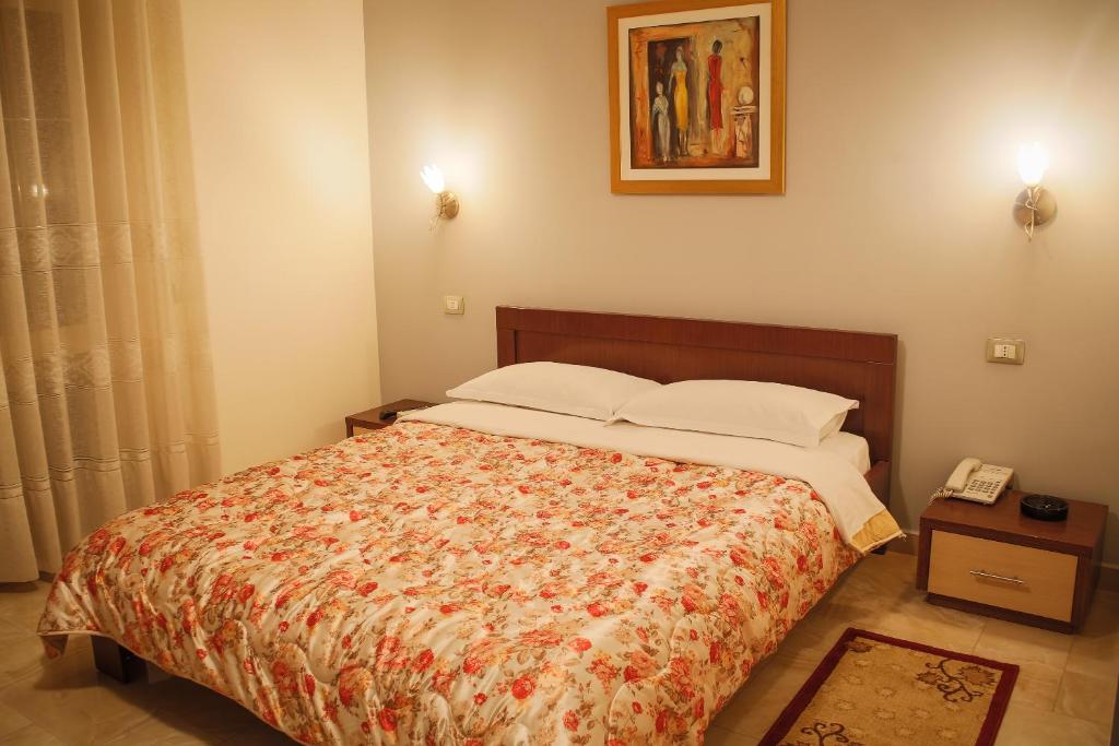 Postel nebo postele na pokoji v ubytování Grand Hotel
