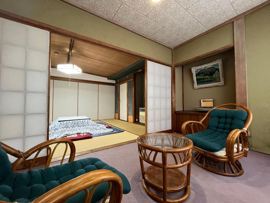 Postel nebo postele na pokoji v ubytování Yokokura Ryokan