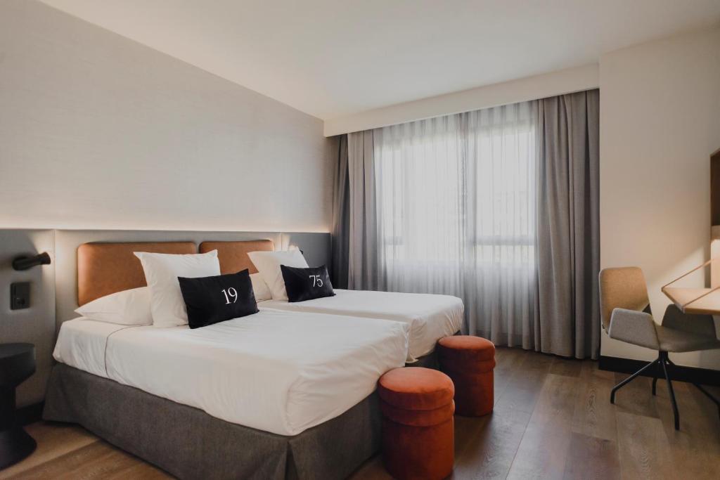 Postel nebo postele na pokoji v ubytování Hotel Dimar