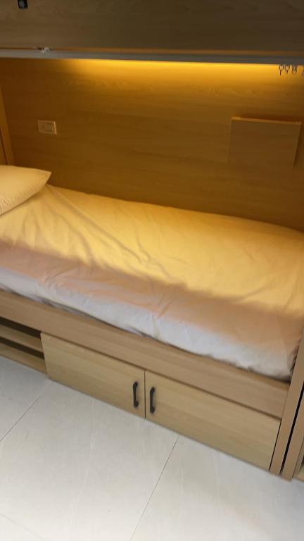 Postel nebo postele na pokoji v ubytování 黎明背包客棧Sunrise Backpackers Hostel