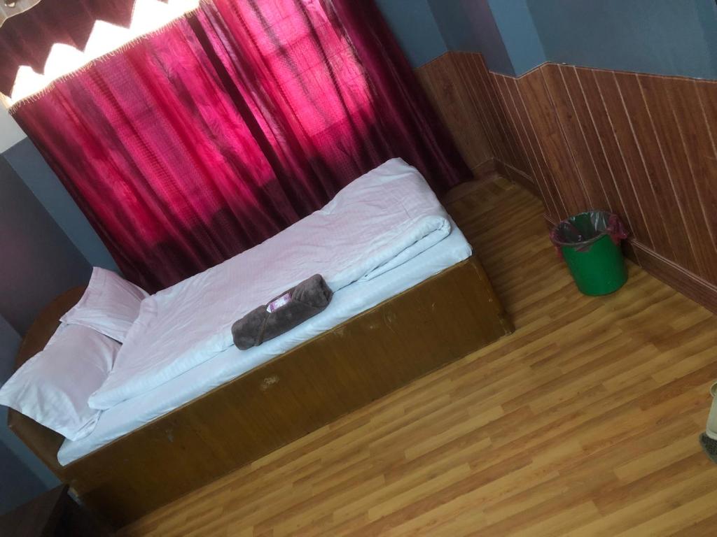Postel nebo postele na pokoji v ubytování HOTEL TRILOK
