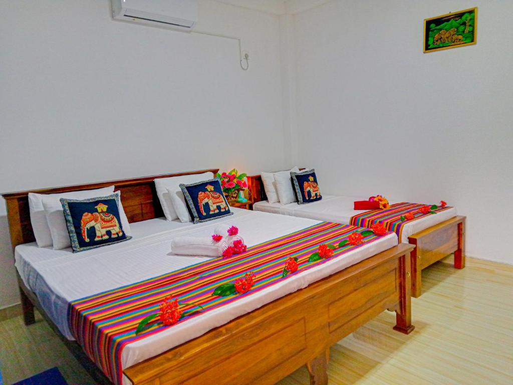 Postel nebo postele na pokoji v ubytování Gimhana Homestay