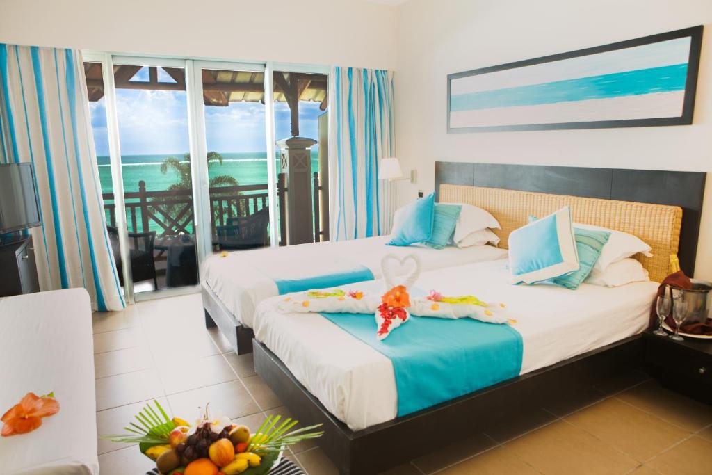 Postel nebo postele na pokoji v ubytování Pearle Beach Resort & Spa