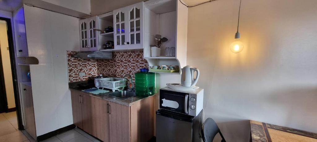 Kuchyň nebo kuchyňský kout v ubytování 312 B Moldex Residences Baguio