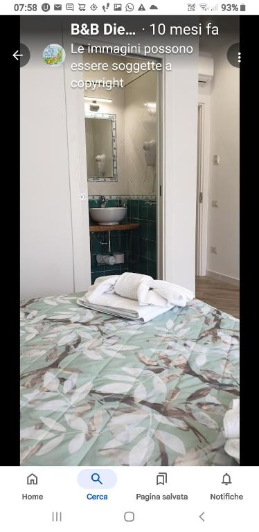 a poster of a bedroom with a bed and a sink at B&B DieMme Amalfi Coast in Vietri sul Mare