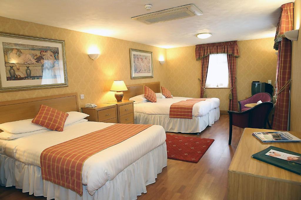 Postel nebo postele na pokoji v ubytování Leapark Hotel