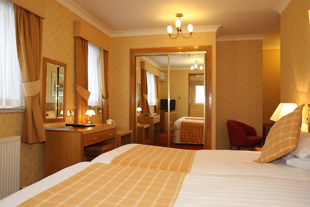 Postel nebo postele na pokoji v ubytování Leapark Hotel