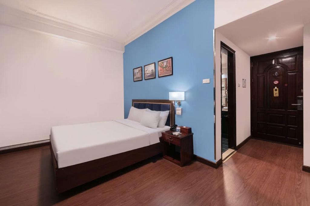 Postel nebo postele na pokoji v ubytování A25 Hotel - 45B Giảng Võ