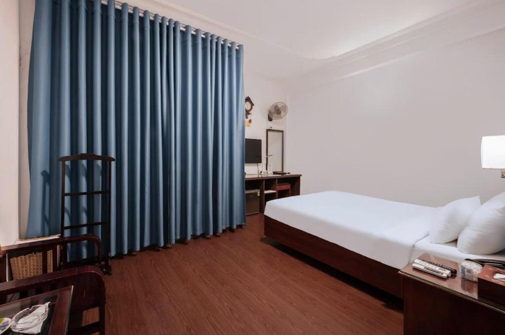 Postel nebo postele na pokoji v ubytování A25 Hotel - 45B Giảng Võ