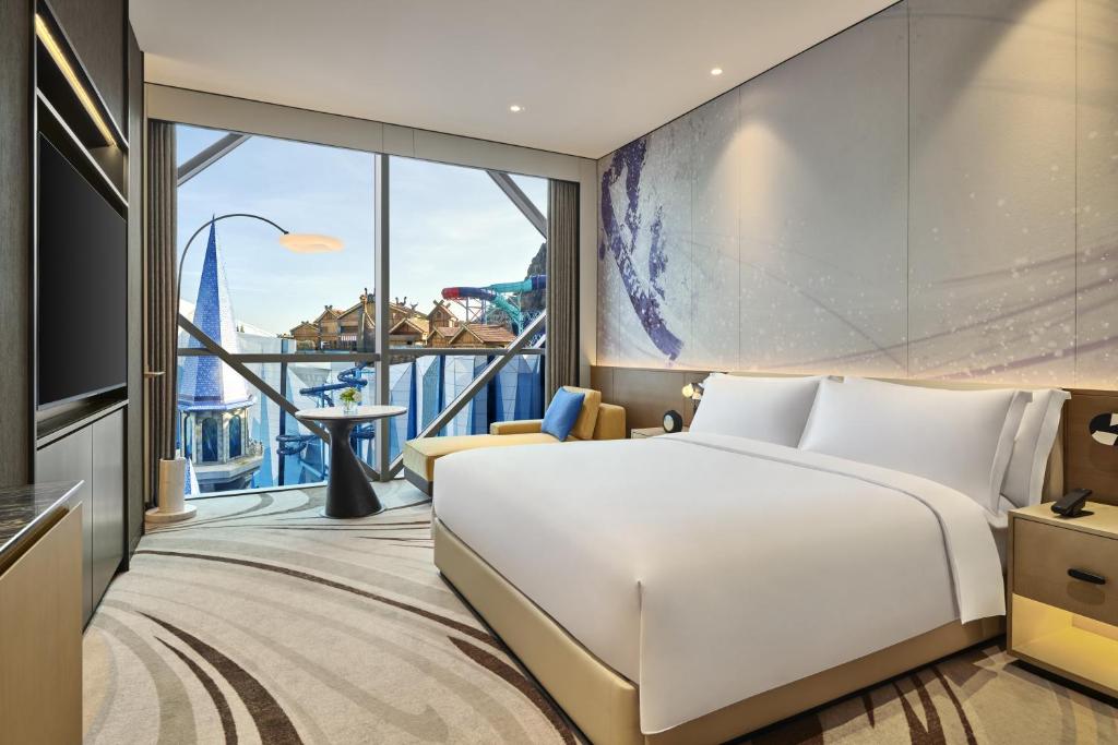 Postel nebo postele na pokoji v ubytování Crowne Plaza Shanghai Snow World by IHG