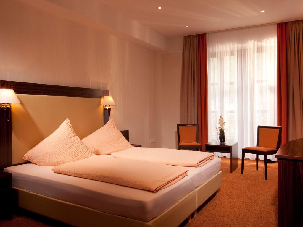 Un pat sau paturi într-o cameră la Beim Weinbauer