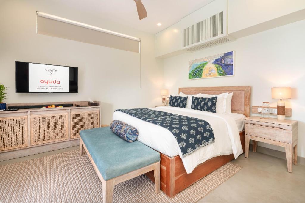Postel nebo postele na pokoji v ubytování Ayuda Sanctuary Wellness Boutique