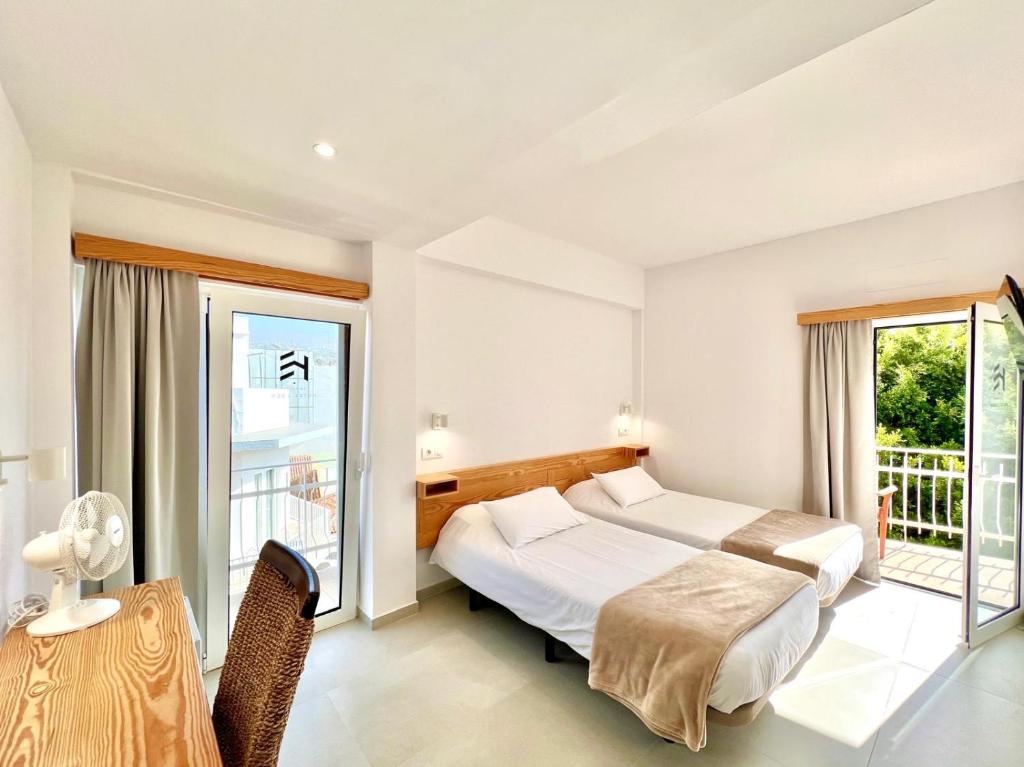 Postel nebo postele na pokoji v ubytování Hotel Edén