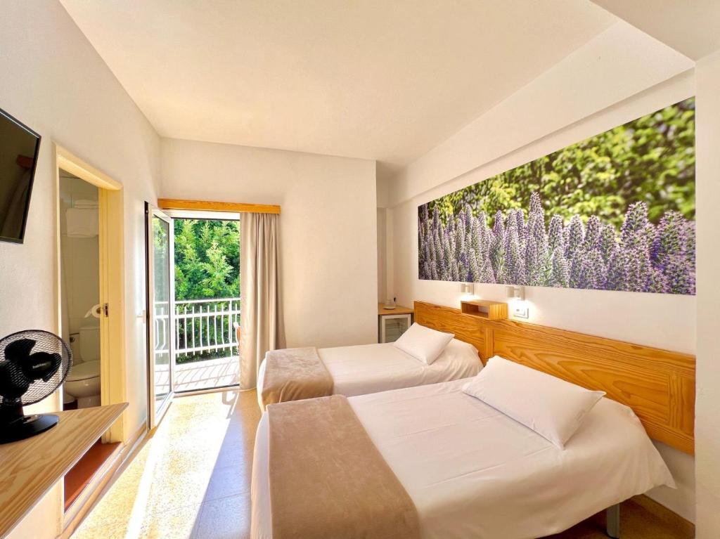 Postel nebo postele na pokoji v ubytování Hotel Edén