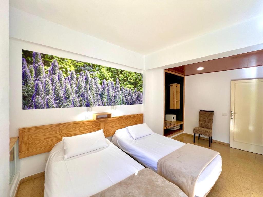 Postel nebo postele na pokoji v ubytování Hotel Edén