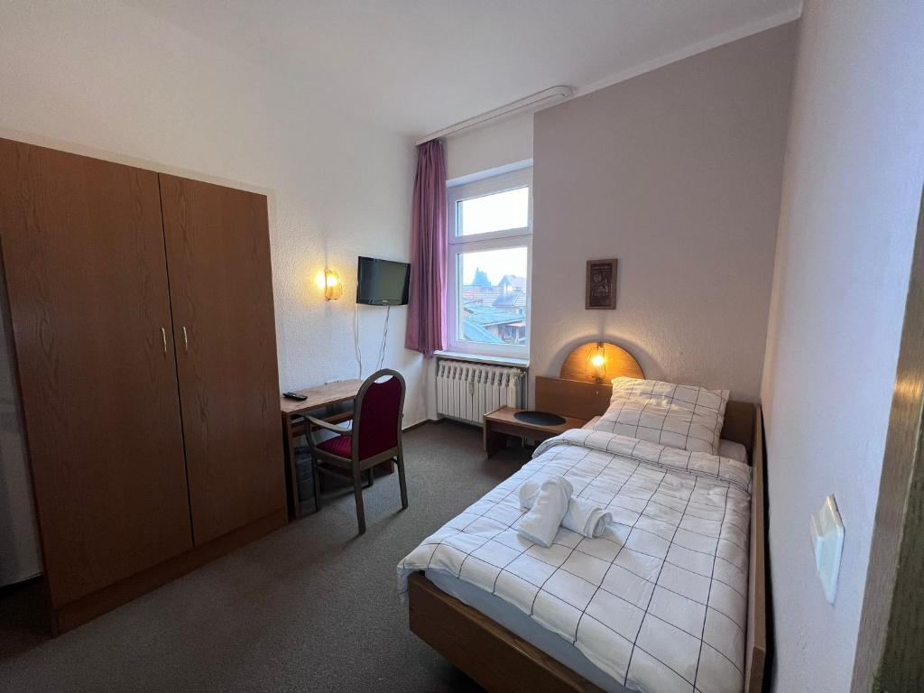 Postel nebo postele na pokoji v ubytování Hotel Doko Gardelegen