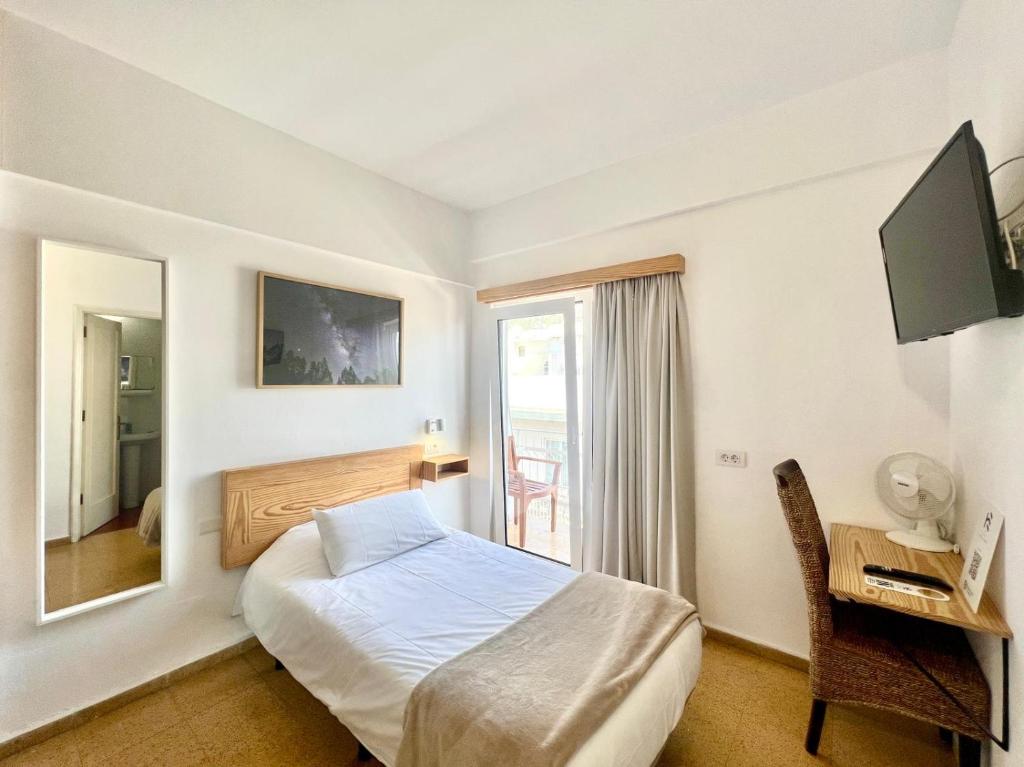 TV a/nebo společenská místnost v ubytování Hotel Edén