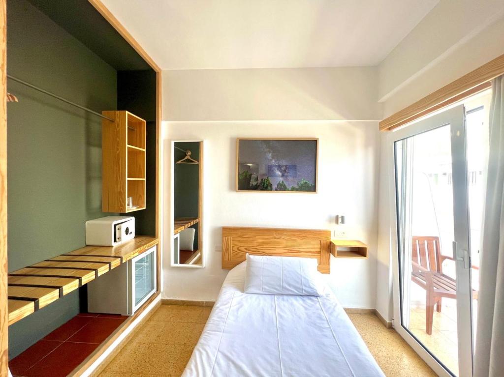Postel nebo postele na pokoji v ubytování Hotel Edén