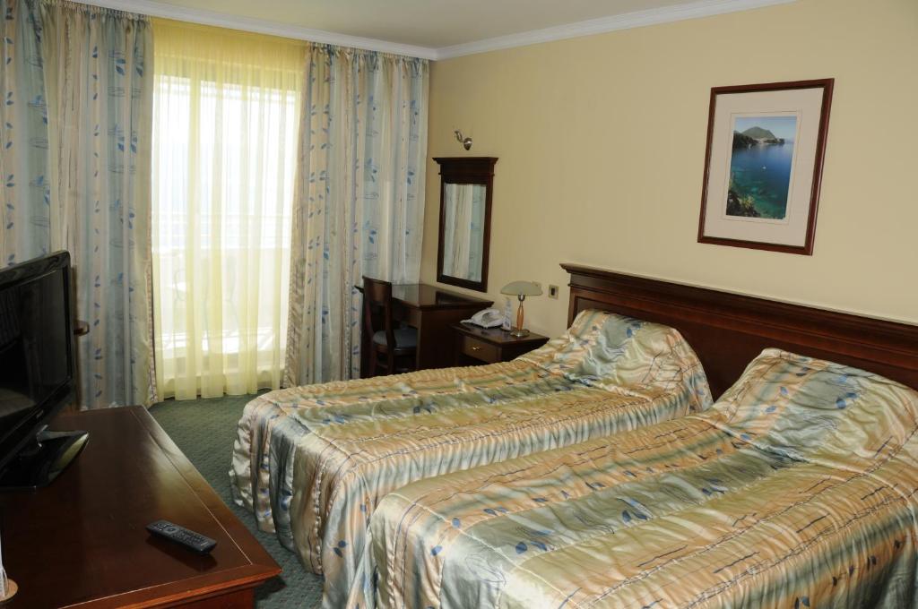 Postel nebo postele na pokoji v ubytování Hotel Granit