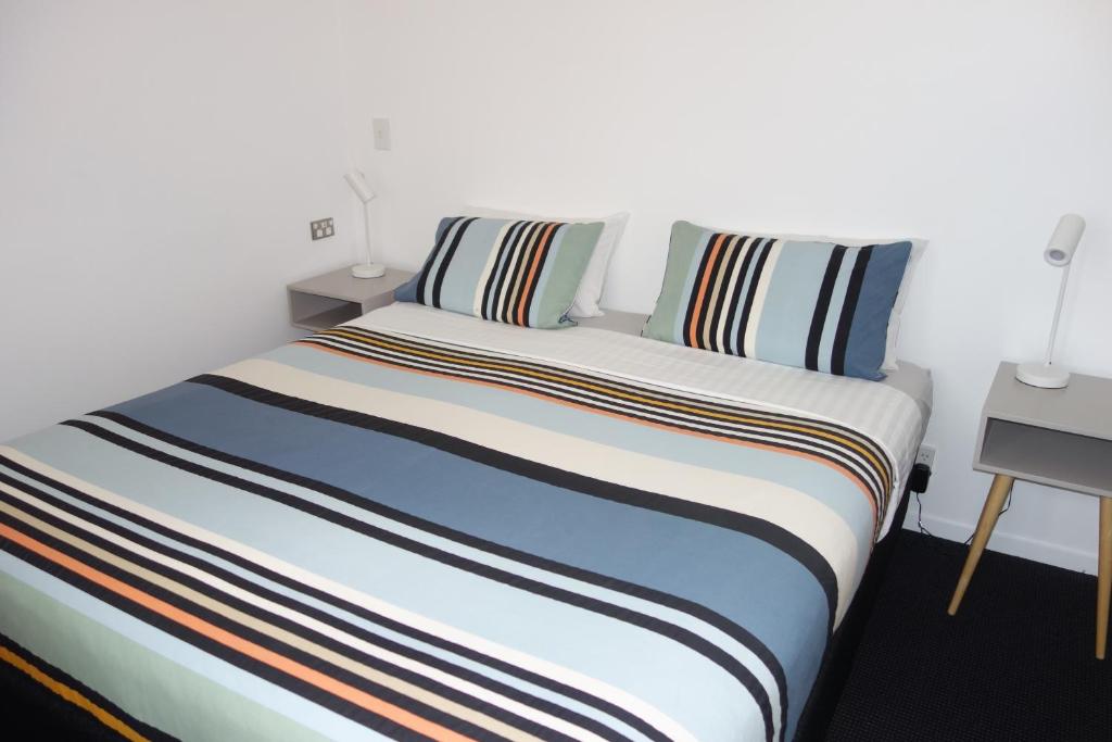 Postel nebo postele na pokoji v ubytování Beachside Villas Motel