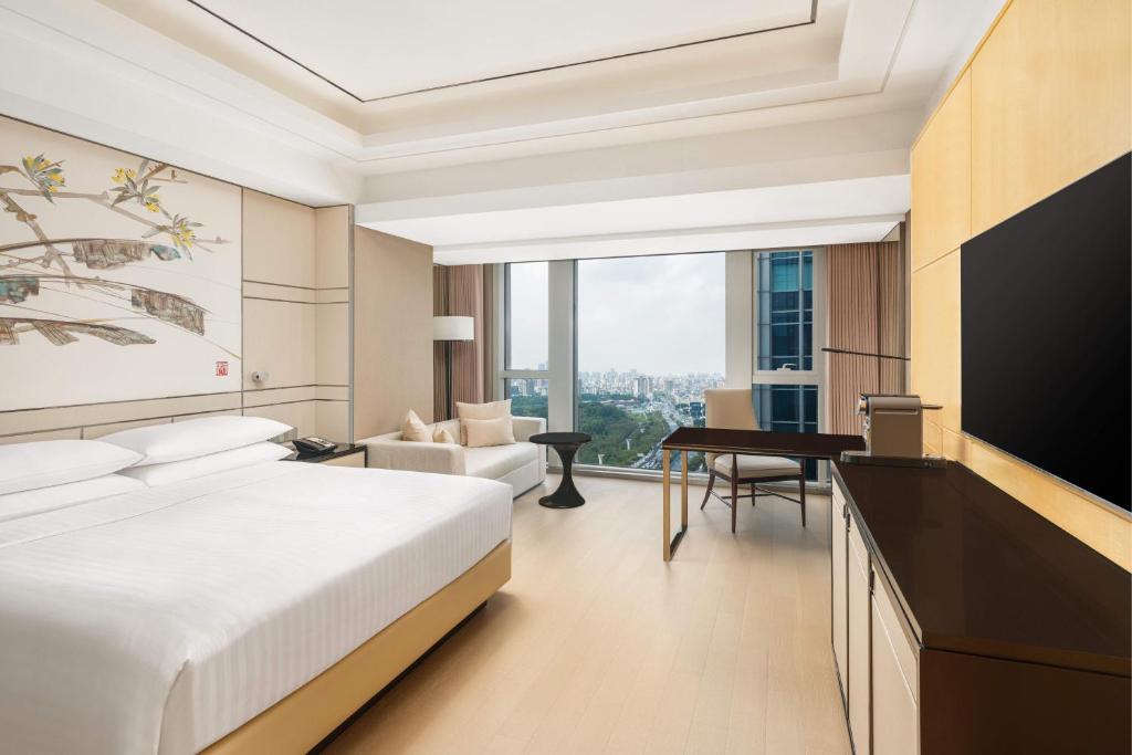 Postel nebo postele na pokoji v ubytování Shanghai Marriott Hotel Parkview