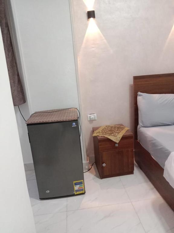 Postel nebo postele na pokoji v ubytování Abo Stait - Pyramid View Homestay