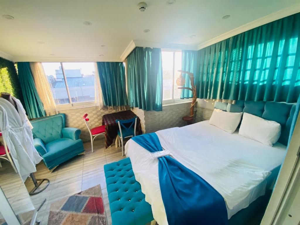Postel nebo postele na pokoji v ubytování Şirinyer Elit Residance Apart Hotel