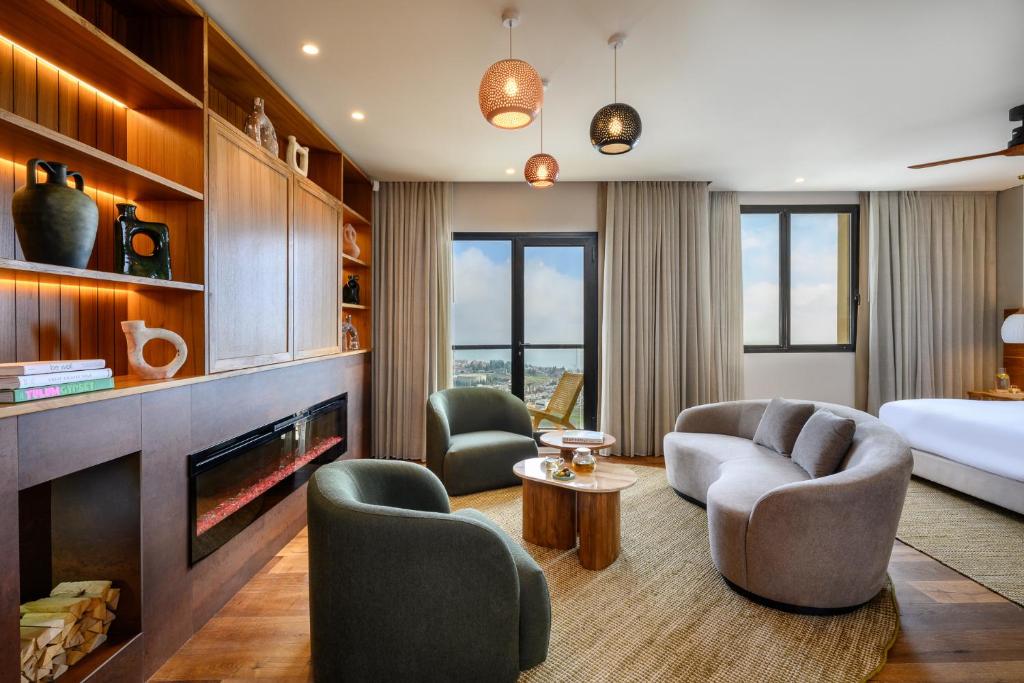Postel nebo postele na pokoji v ubytování Hotel Canaan - Fattal Limited Edition