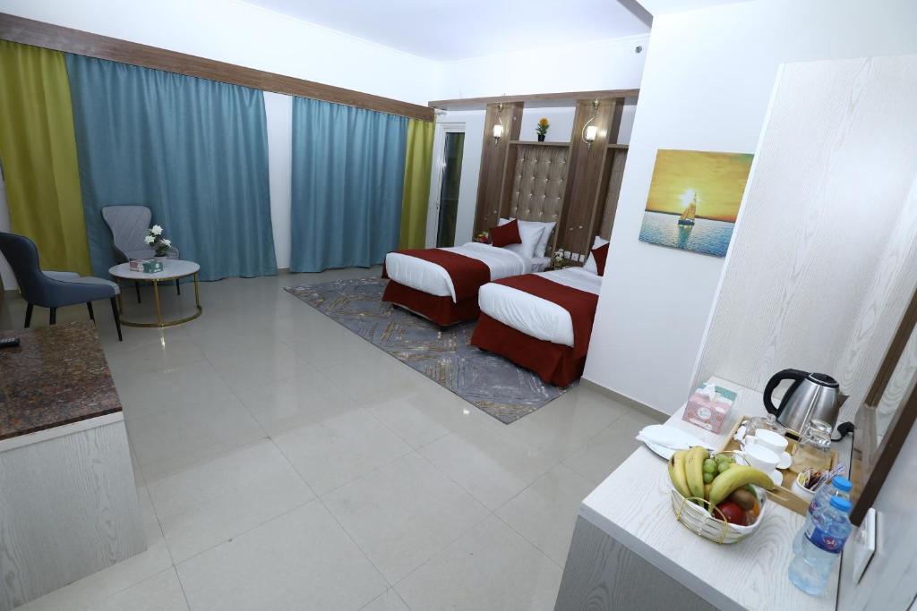 a hotel room with a bedroom and a bed at Naif Fort Hotel in Dubai