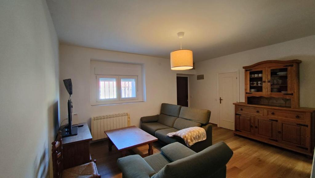 a living room with a couch and a table at House Casa in Sotillo de la Adrada in Sotillo de la Adrada