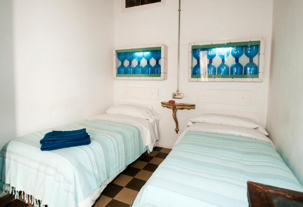 Postel nebo postele na pokoji v ubytování Ibiza Boutique Guest House