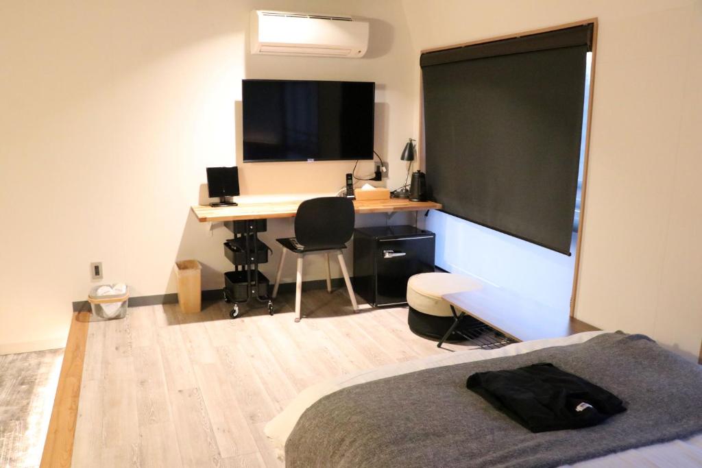 TV a/nebo společenská místnost v ubytování Fukuyama Royal Hotel