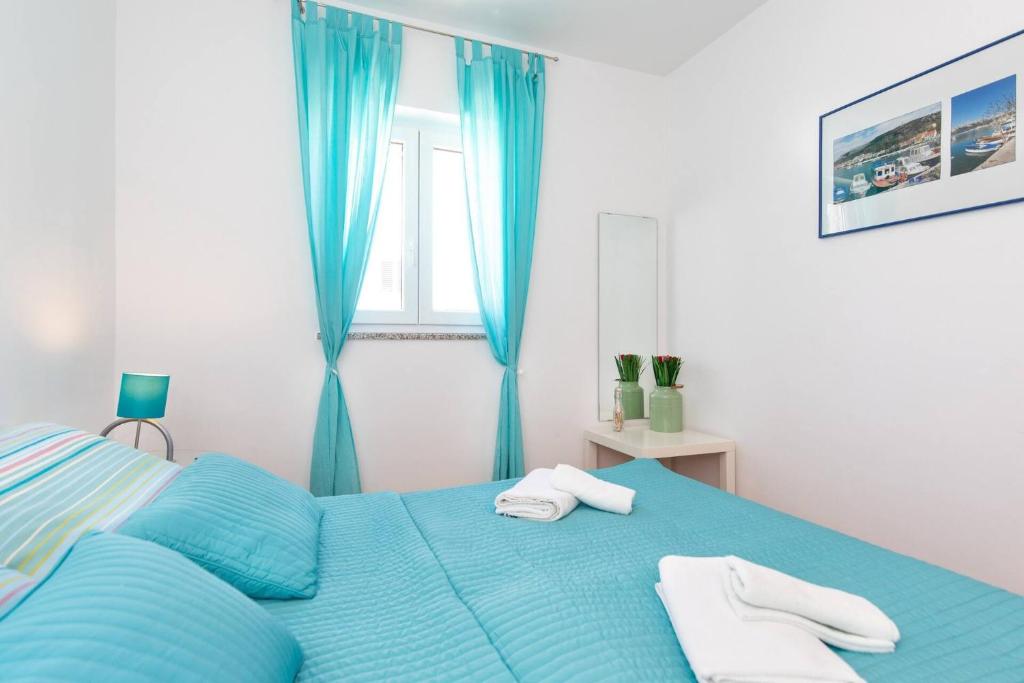 Postel nebo postele na pokoji v ubytování Apartment Lavendel - P. Dorcica