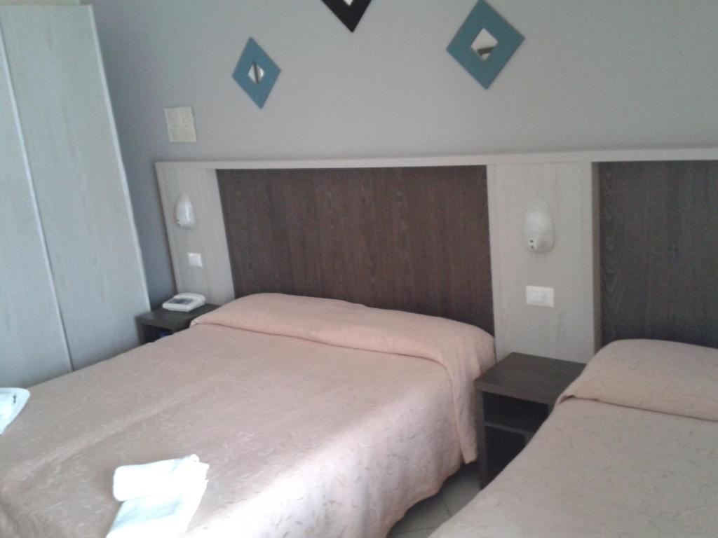 Postel nebo postele na pokoji v ubytování Hotel Senyor