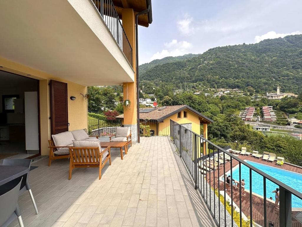 a balcony of a house with a swimming pool at Like Heaven Argegno Pool & Lake View in Argegno