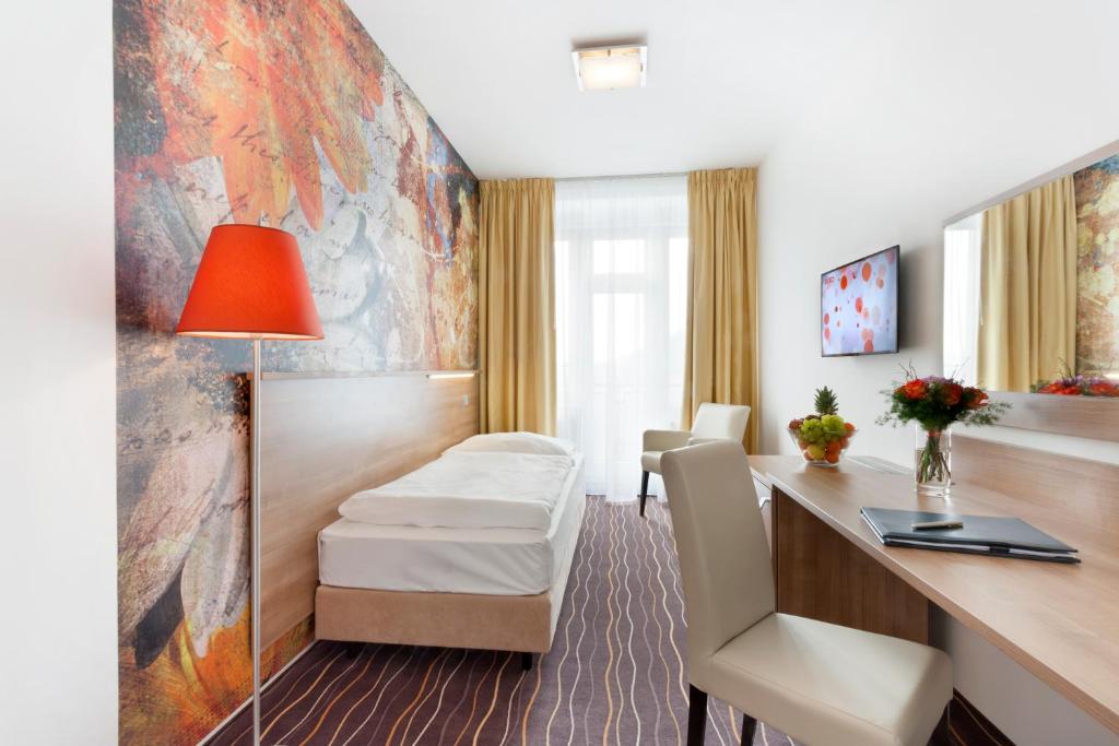 TV a/nebo společenská místnost v ubytování Akcent hotel