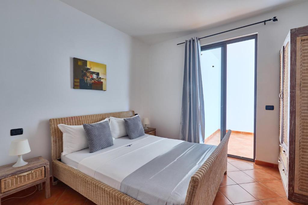 Postel nebo postele na pokoji v ubytování Patio Antigo Residence