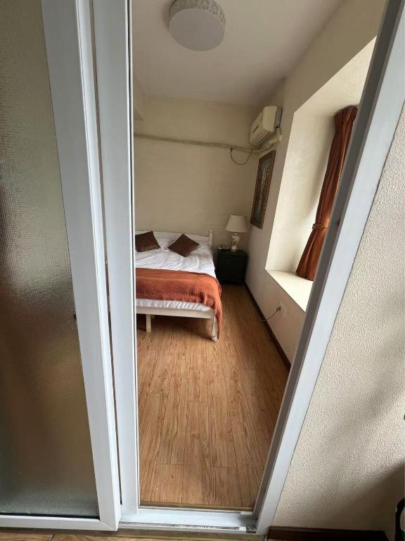 Postel nebo postele na pokoji v ubytování Rolla Cottage南岸亚太商谷
