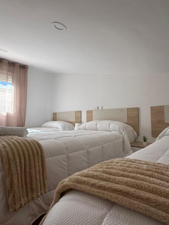 Posteľ alebo postele v izbe v ubytovaní Duplex Arrebol
