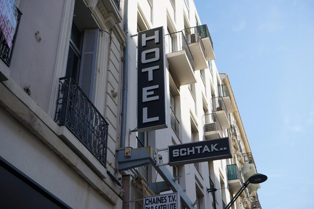 a hotel sign on the side of a building at Hotel Schtak in Cannes