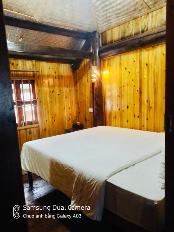 Postel nebo postele na pokoji v ubytování H'mong Eco House