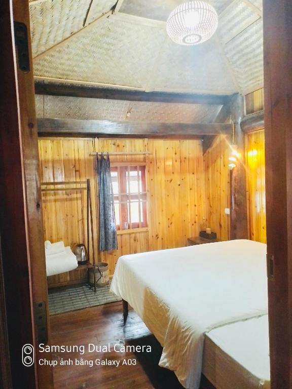 Postel nebo postele na pokoji v ubytování H'mong Eco House