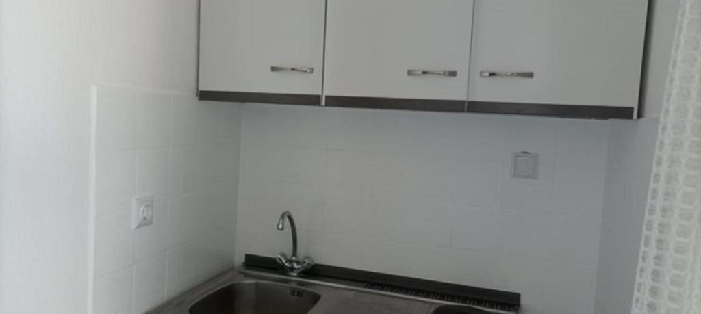 Kuchyň nebo kuchyňský kout v ubytování Vanta Hotel