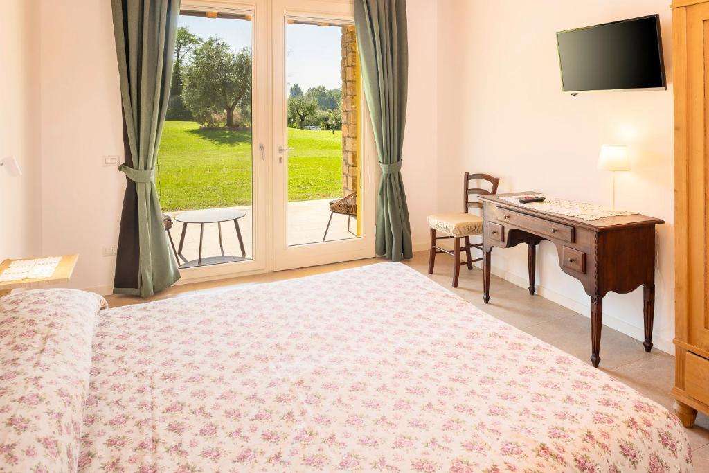 Postel nebo postele na pokoji v ubytování Azienda Agricola Rovertondo