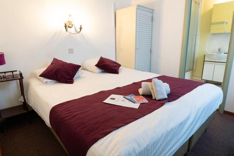 Postel nebo postele na pokoji v ubytování Flandria Hotel