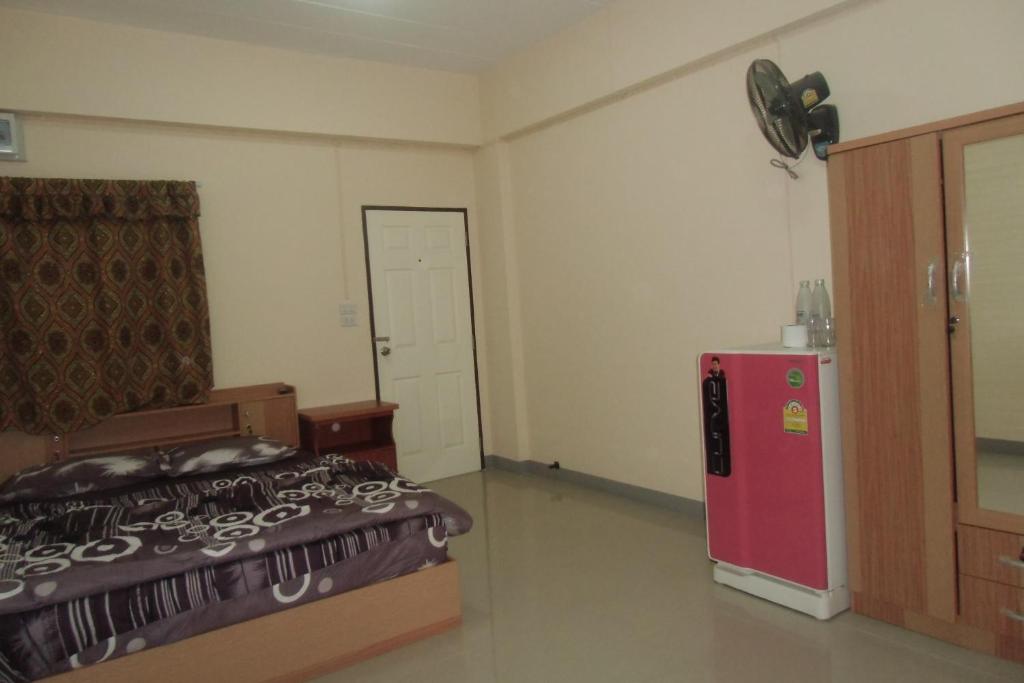 Postel nebo postele na pokoji v ubytování Chanaporn Place