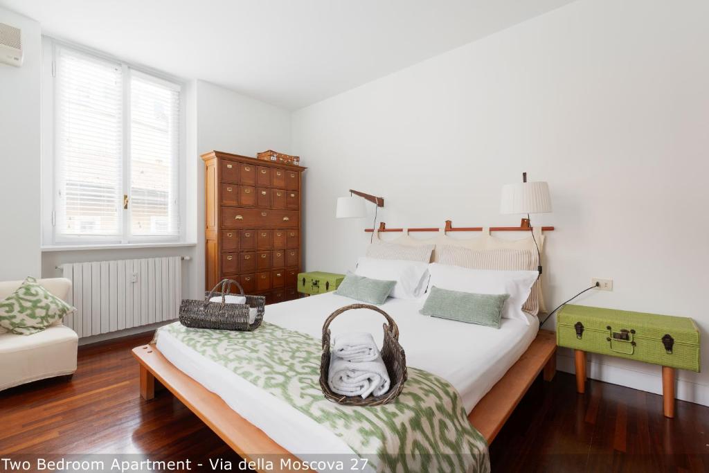Posteľ alebo postele v izbe v ubytovaní Brera Apartments in Moscova